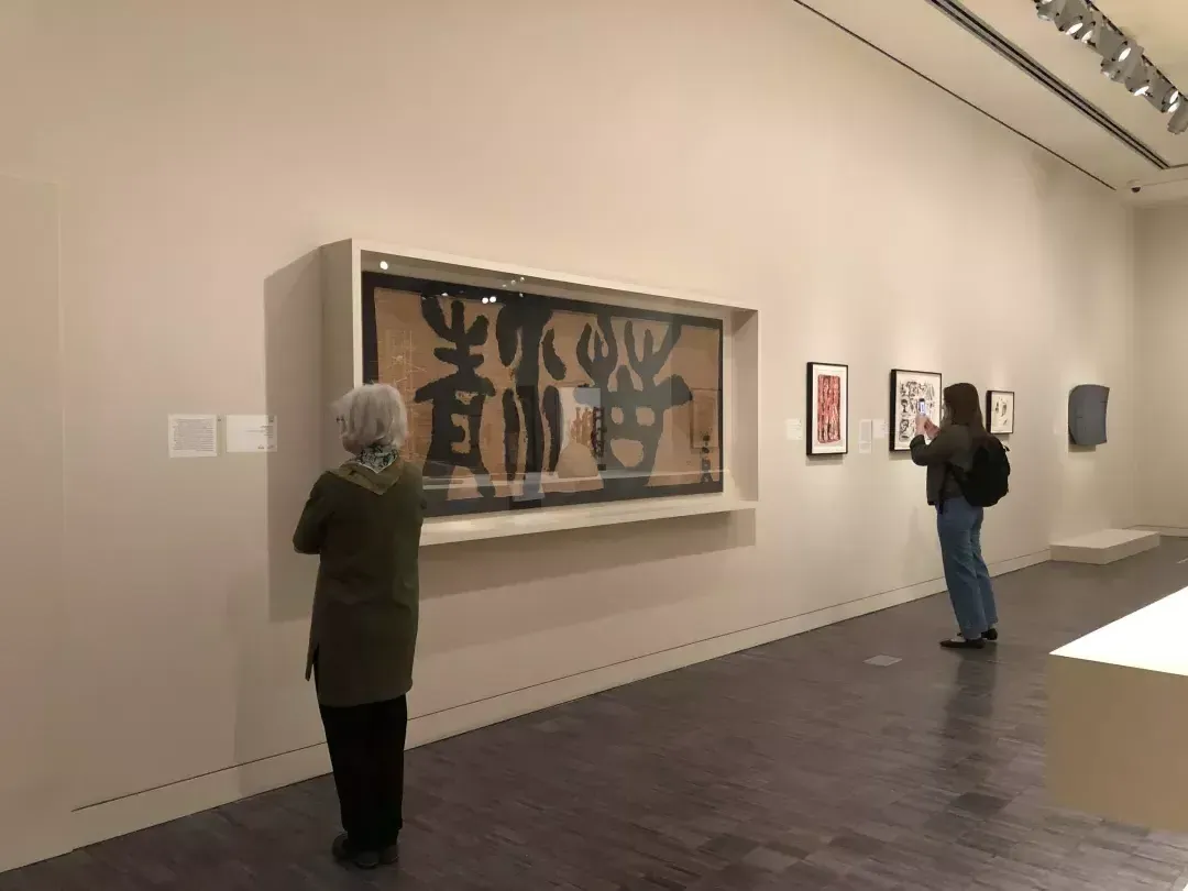 Guests explore the Asian Art Musem's collection.